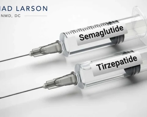 Close-up of medical syringes labeled Semaglutide and Tirzepatide, representing popular GLP-1 treatments for weight management.